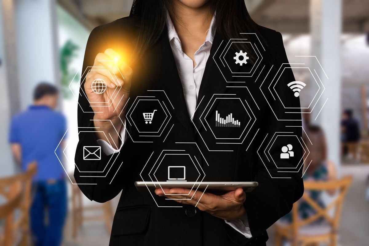 Digital marketing media in virtual icon globe shape business open his hand, working touch screen tablet.